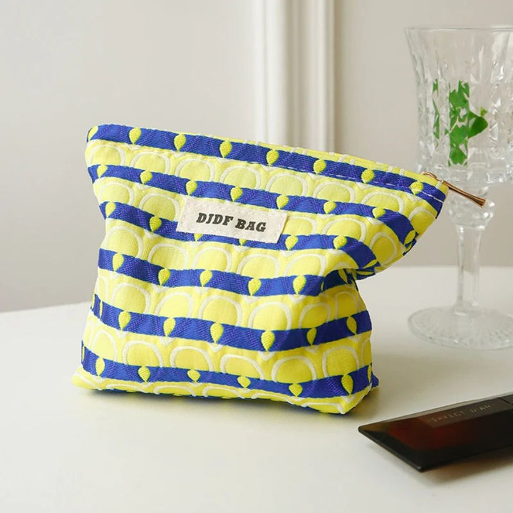 Petite trousse de maquillage motifs plumes de paon