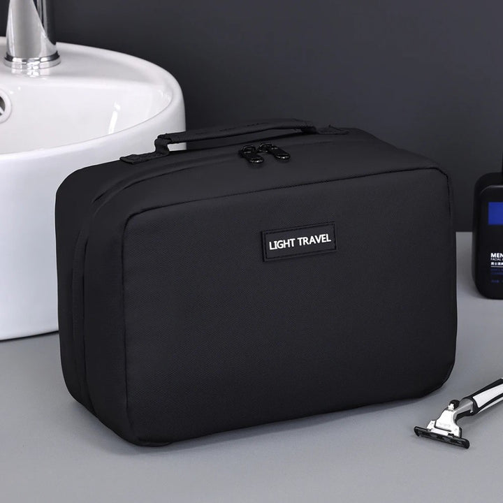 trousse de toilette noire élégante avec poignée de transport renforcée
