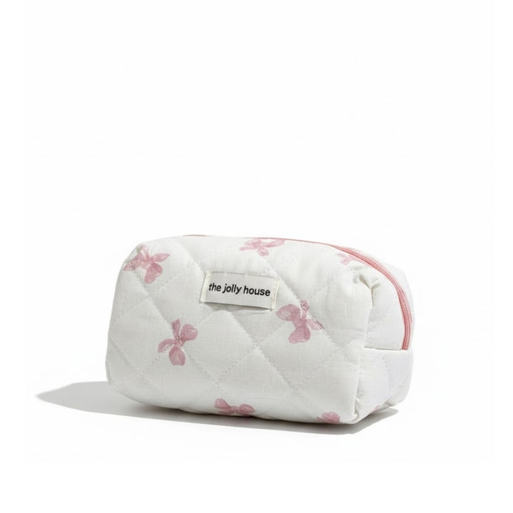 Petite trousse de toilette tissu matelassé blanche à motifs nœuds roses